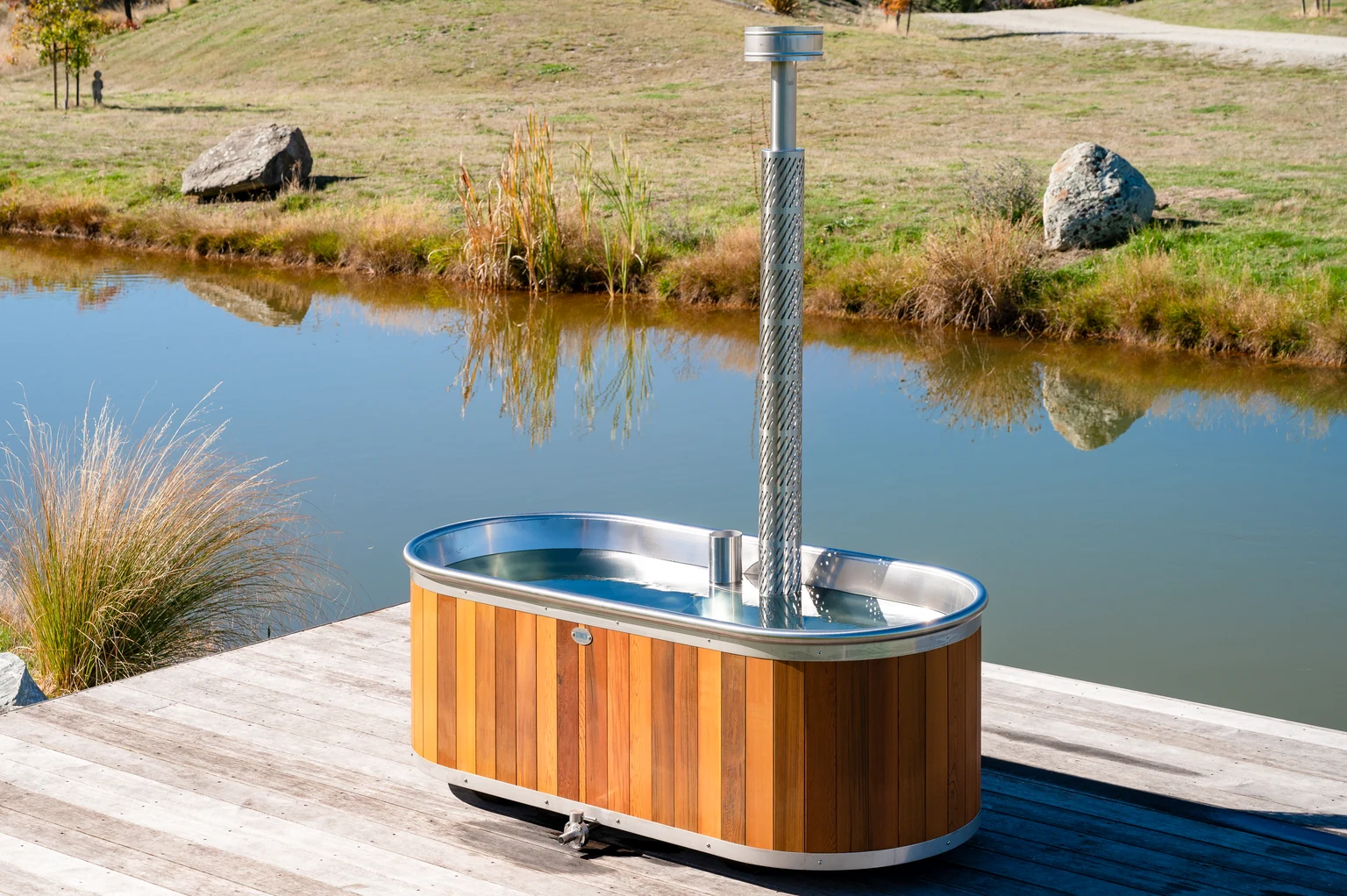 Wood-Fired Bath beside a pond